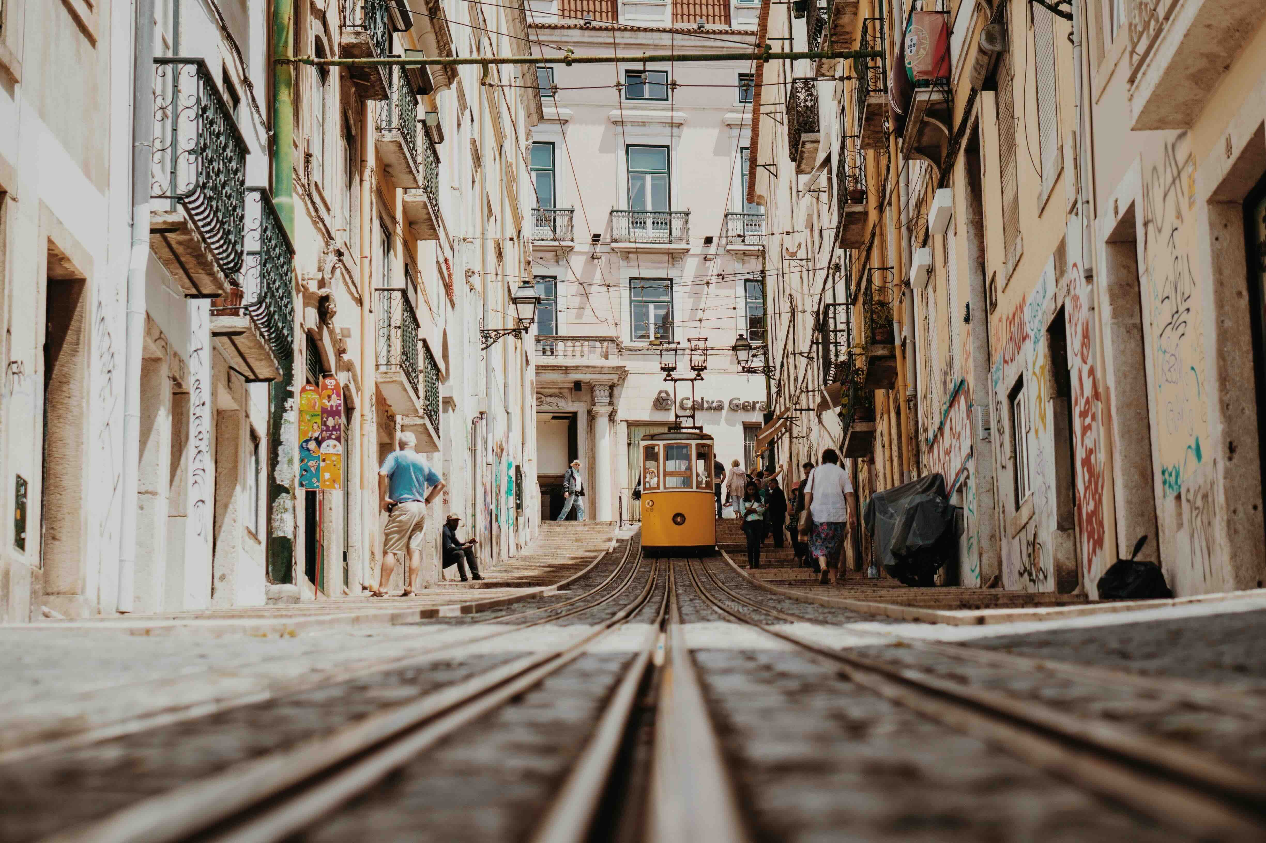 Lisbon hill with yellow tram coming down