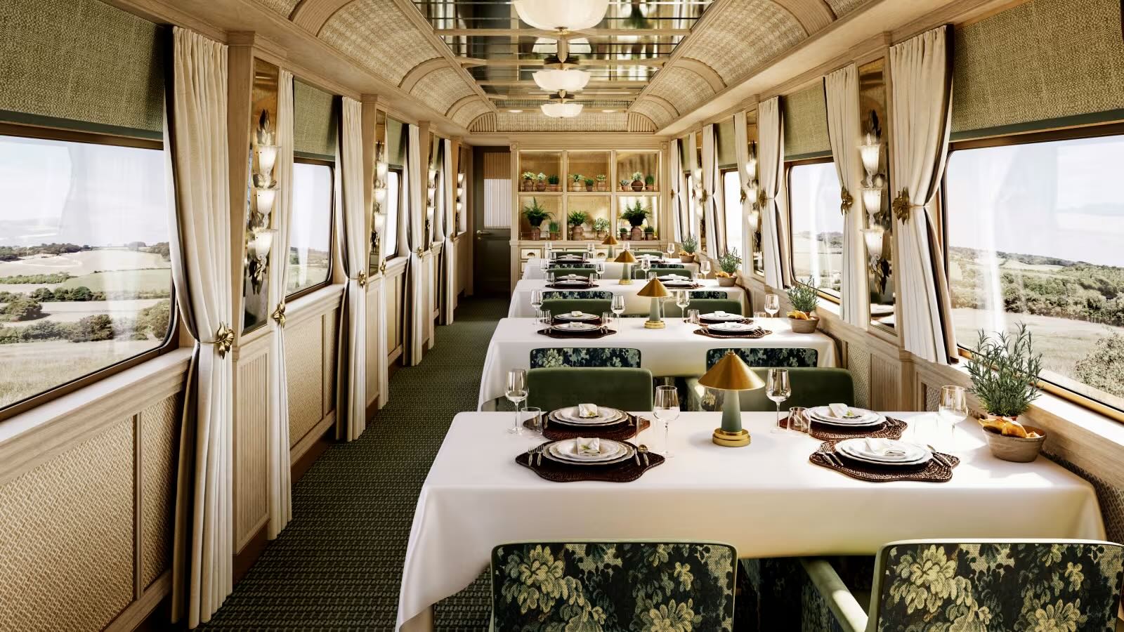 Belmond dining on its Britannic Explorer sleeper train. Tables set up in the dining cabin.